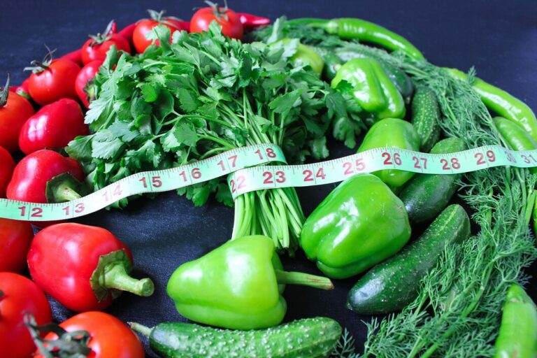 fresh-organic-parsley-tomatoes-red-peppers-green-peppers-fennel-dill-cucumber-with-green-centimeter-top-view-diet-concept_114579-1233