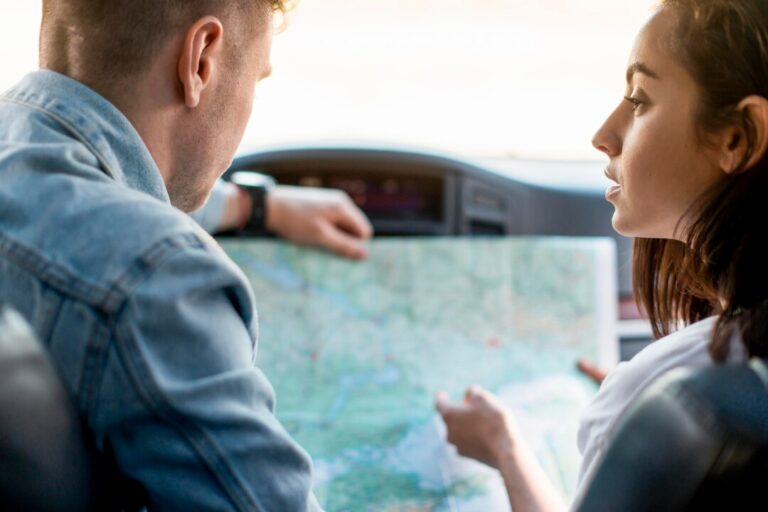 close-up-couple-with-road-map_23-2148637376