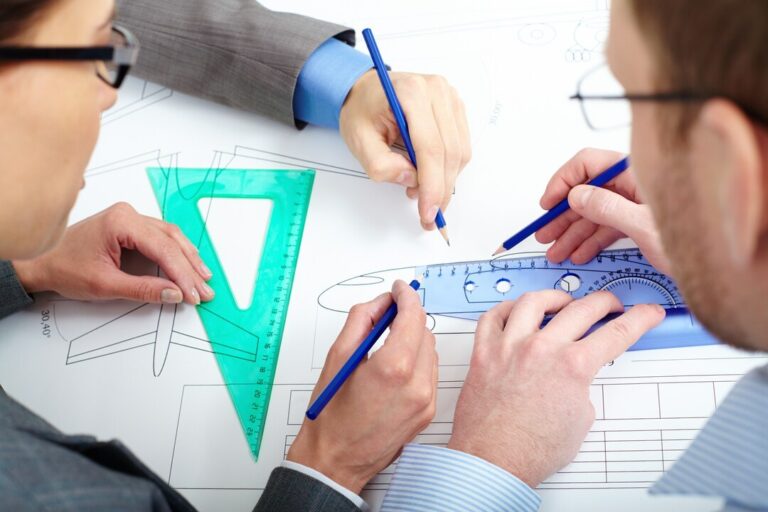 close-up-engineers-improving-sketch_1098-1513