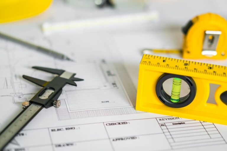 construction-plans-with-helmet-drawing-tools-blueprints_1232-4299